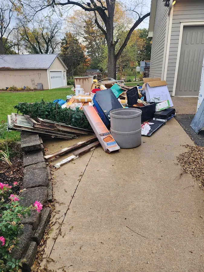 Dumpster being loaded with debris for Residential Dumpster Rental in Tamarac